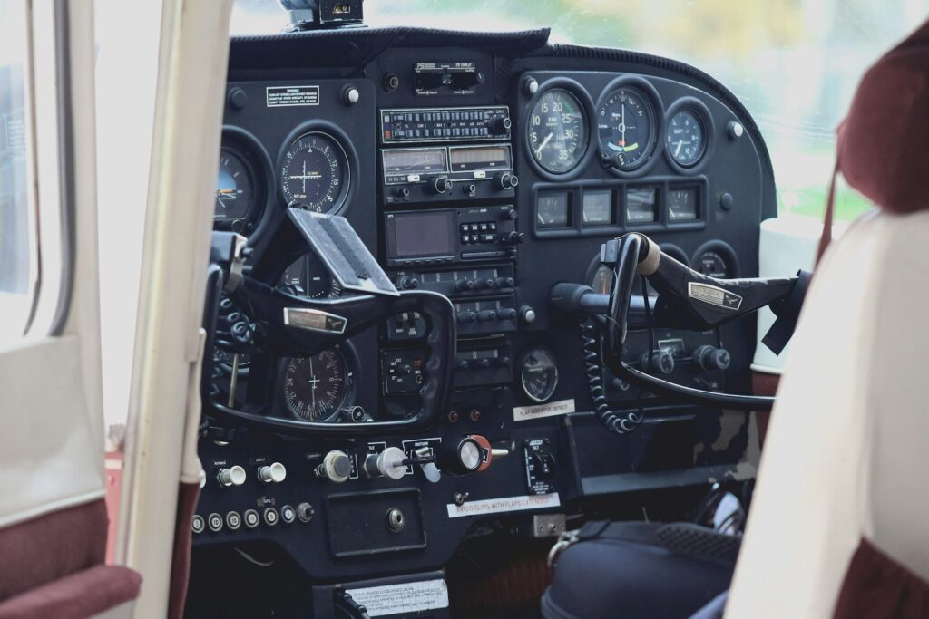 the cockpit of a small airplane with a lot of instruments