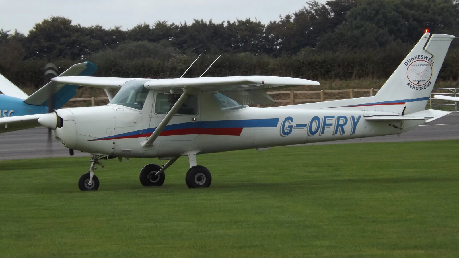 Cessna 152 training aircraft G-OFRY on the grass at Dunkeswell Aerodrome, Devon