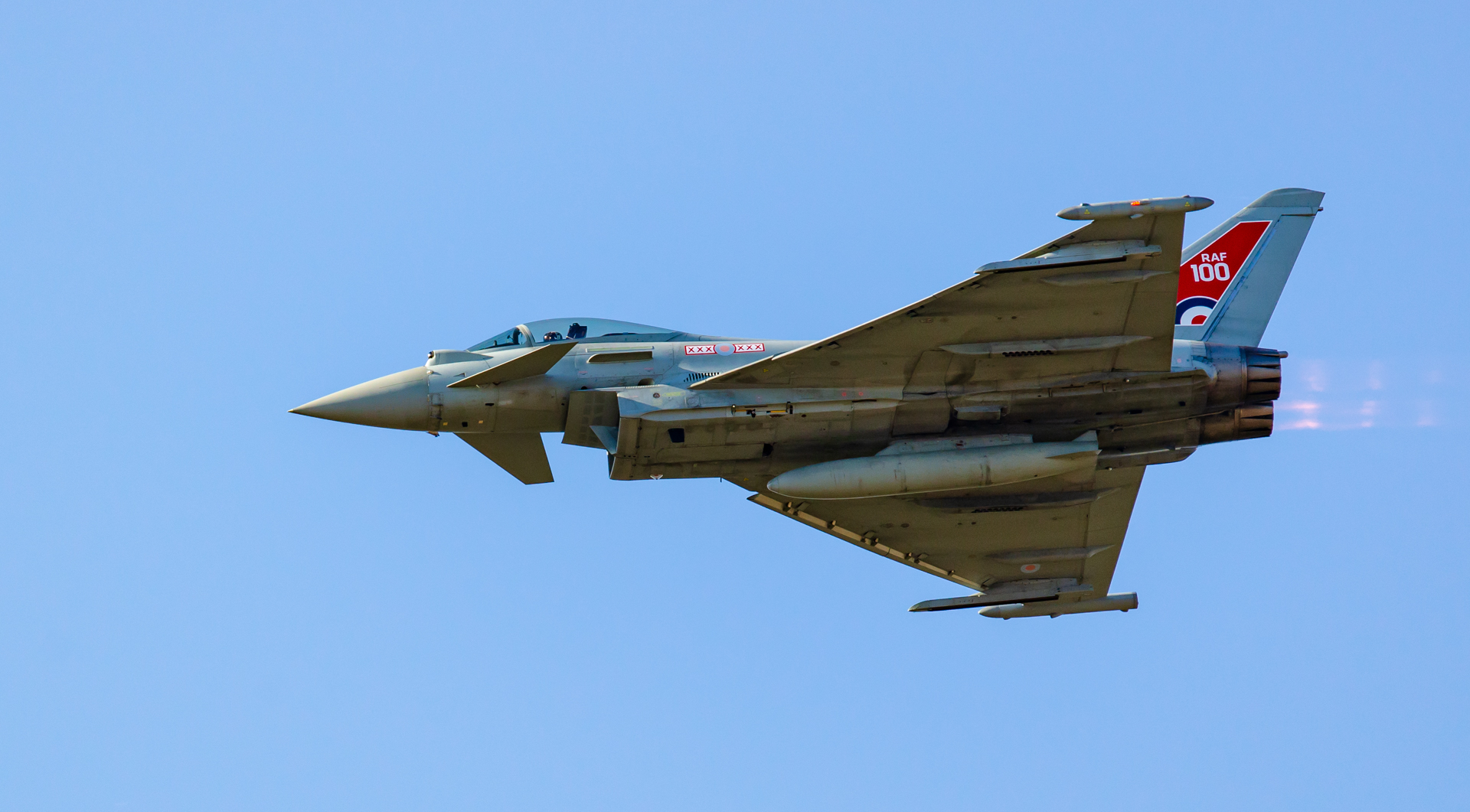 RAF Eurofighter Typhoon in RAF 100 display livery flying against a clear blue sky